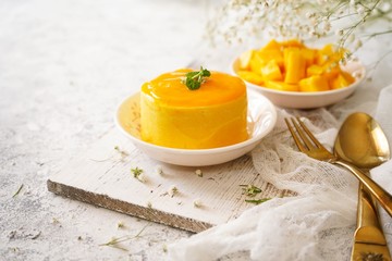 Mango Mousse with sliced ripe mangoes on side, selective focus
