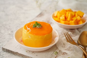 Mango Mousse with sliced ripe mangoes on side, selective focus