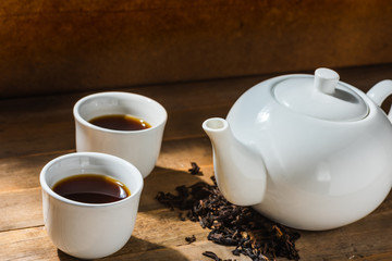 Obraz na płótnie Canvas white chinese tea set on wooden table