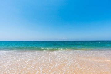 Fototapeta na wymiar soft sea wave on sand beach and scenic natural seascape background