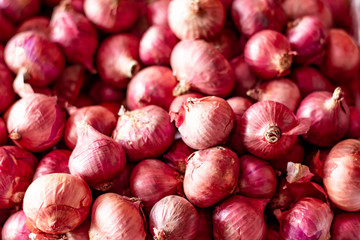 A pile of onions. Onion used in cooking with a pungent taste and smell. selective focus. 