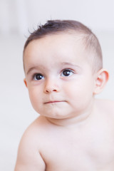 sweet baby look  playing on the ground