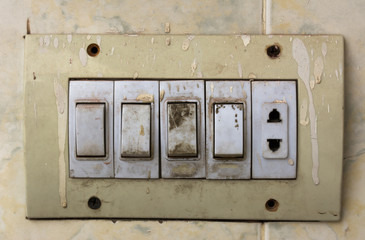 Switch board with paint splashes and dust
