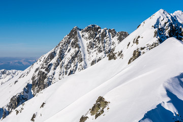 Fototapeta na wymiar Tatra ridge with snowy scenery.