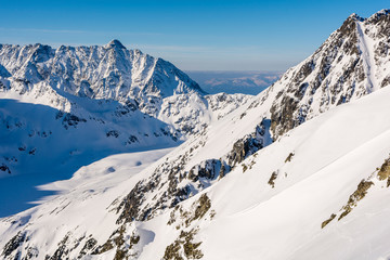 Peaks and valley with snowy scenery view in the morning.