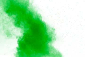 Fototapeta na wymiar Green color powder explosion cloud on white background. Green dust splash.
