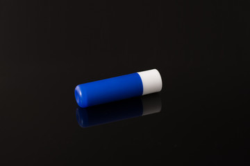 chat stick blue tube isolated on black background