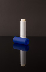 chat stick blue tube isolated on black background