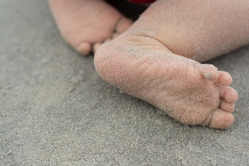 Baby feet in a beach