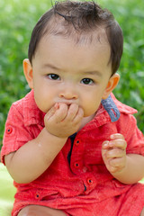 Baby boy eating watermelon