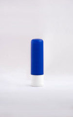 chap stick lip balm, blue tube isolated on white background