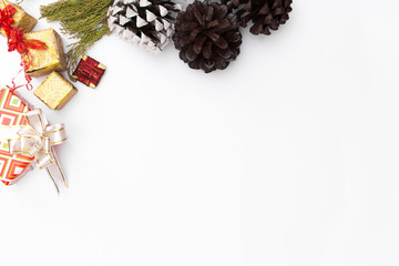 Christmas mockup composition. Christmas gift, pine cones, fir branches on wooden white background. top view, copy space