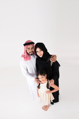 Arab family standing on white background