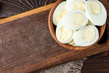 Obraz na płótnie Canvas Boiled eggs on dark wooden background.