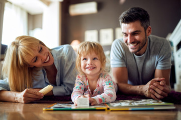 Fototapeta premium Happy female child with parents