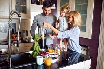 Family with daughter preparing meal