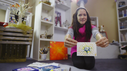 Fototapeta premium Happy woman show a creative painted card