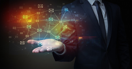 Elegant businessman holding communication concept on his hand 