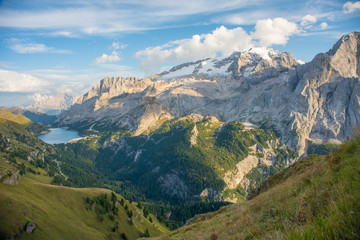 Fototapeta na wymiar Marmolada mountain and Fedaia Lake. Marmolada is the highest mountain of the Dolomites, situated in northeast of Italy.