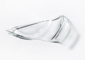 Parts of the broken cup jar glass isolated on white background. Pieces of sharp broken glass. Concept of danger.