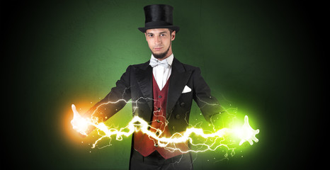 Magician sparkling super power between his two hands