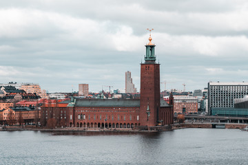 Fototapeta premium The Stockholm City Hall by the river Riddarfjarden, a classical picture, Sweden