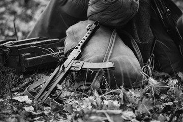 World War II Soviet Red Army Weapon. Submachine Gun PPS-43  On Ground. WWII WW2 Russian Ammunition. Photo In Black And White Colors