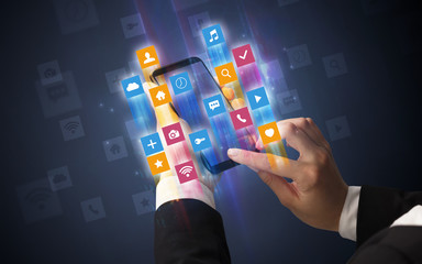 Female hand using smartphone with colorful angular fast switching application icons around