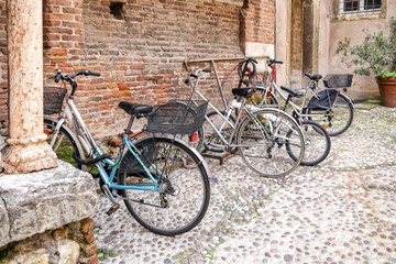 Fototapeta na wymiar Bicycles by the old brick wall