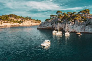 Cote de Azur, France. White Yachts boats in bay. Calanques - a deep bay surrounded by high cliffs in the azure coast of France
