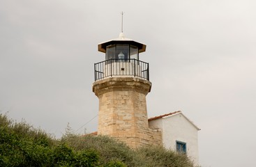 Old historic lighthouse in Cyprus and sky 