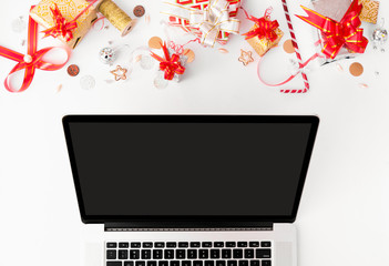 christmas composition with laptop, mock up for christmas time, red and gol decor on white background. © Zubair