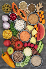 Alkaline super food concept for ph balance with fresh fruit, vegetables, legumes, nuts, herbs, spice, whole wheat pasta, seeds & nuts. High in omega 3, antioxidants, anthocyanins, fibre & vitamins.  