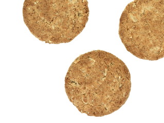Round whole wheat biscuit, cookie with raisins isolated on white background. Biscuits with whole-wheat (wholemeal) flour isolated on white background 