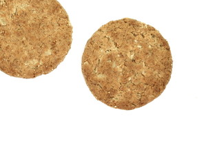 Round whole wheat biscuit, cookie with raisins isolated on white background. Biscuits with whole-wheat (wholemeal) flour isolated on white background 