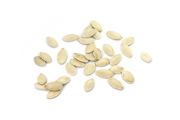 Heap of pumpkin seeds isolated on white background