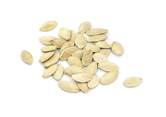 Heap of pumpkin seeds isolated on white background