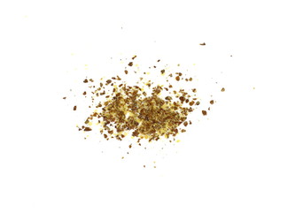 Ground or crushed brown flax seed or linseed isolated on white.