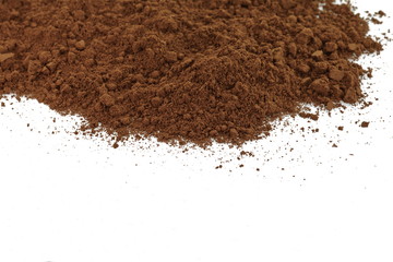 Coffee powder isolated of white background. A little coffee over a white surface. Milled coffee.