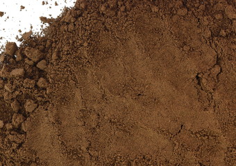 Coffee powder isolated of white background. A little coffee over a white surface. Milled coffee.
