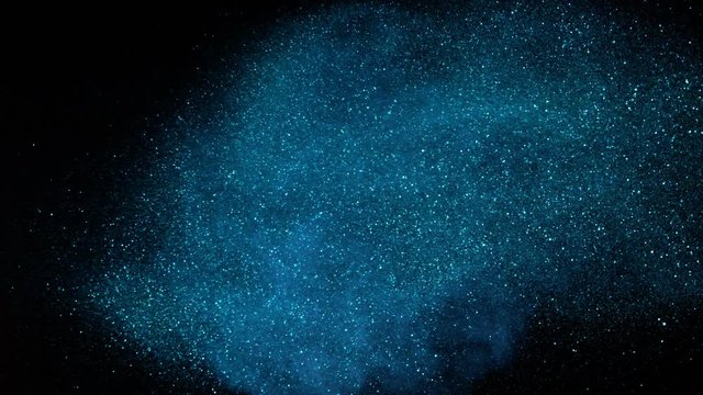 Blue glitter explosion in super slow motion. Shooted with high speed cinema camera at 1000fps 4K