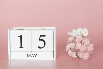 May 15th. Day 15 of month. Calendar cube on modern pink background, concept of bussines and an importent event.