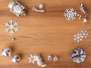 Christmas composition. Christmas gift, pine cones, fir branches on wooden golden background. Flat lay, top view