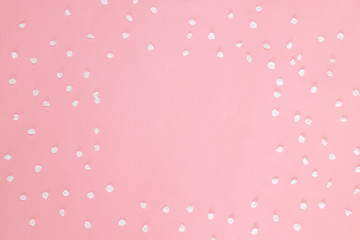 Flower petals on pastel pink background. Flat lay, top view, copy space