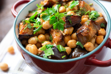 Cooked chickpeas with eggplants and parsley. Oriental food, vegetarian food.