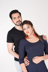 Fototapeta premium young couple together posing on white background