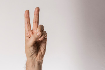man's hand gesture, counting number two, isolated on white background