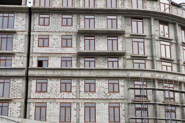 new building under construction, scaffolding and concrete