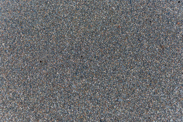 Closeup of Black Sand on a Volcanic Beach in Sicily for Backgrounds