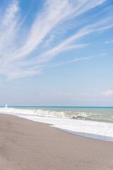 Cloudscape and Volcanic Black Sand Beach and Blue Ionian Sea in Sicily